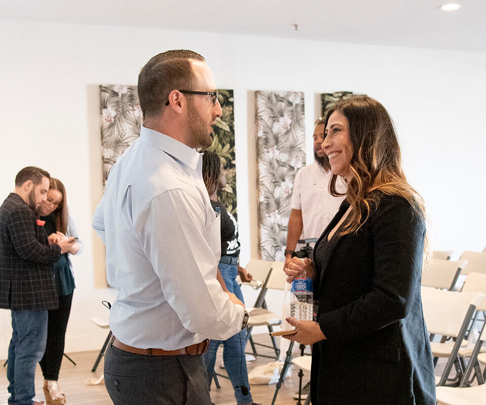 Charlie speaking to Jessica at Be Plant Summit
